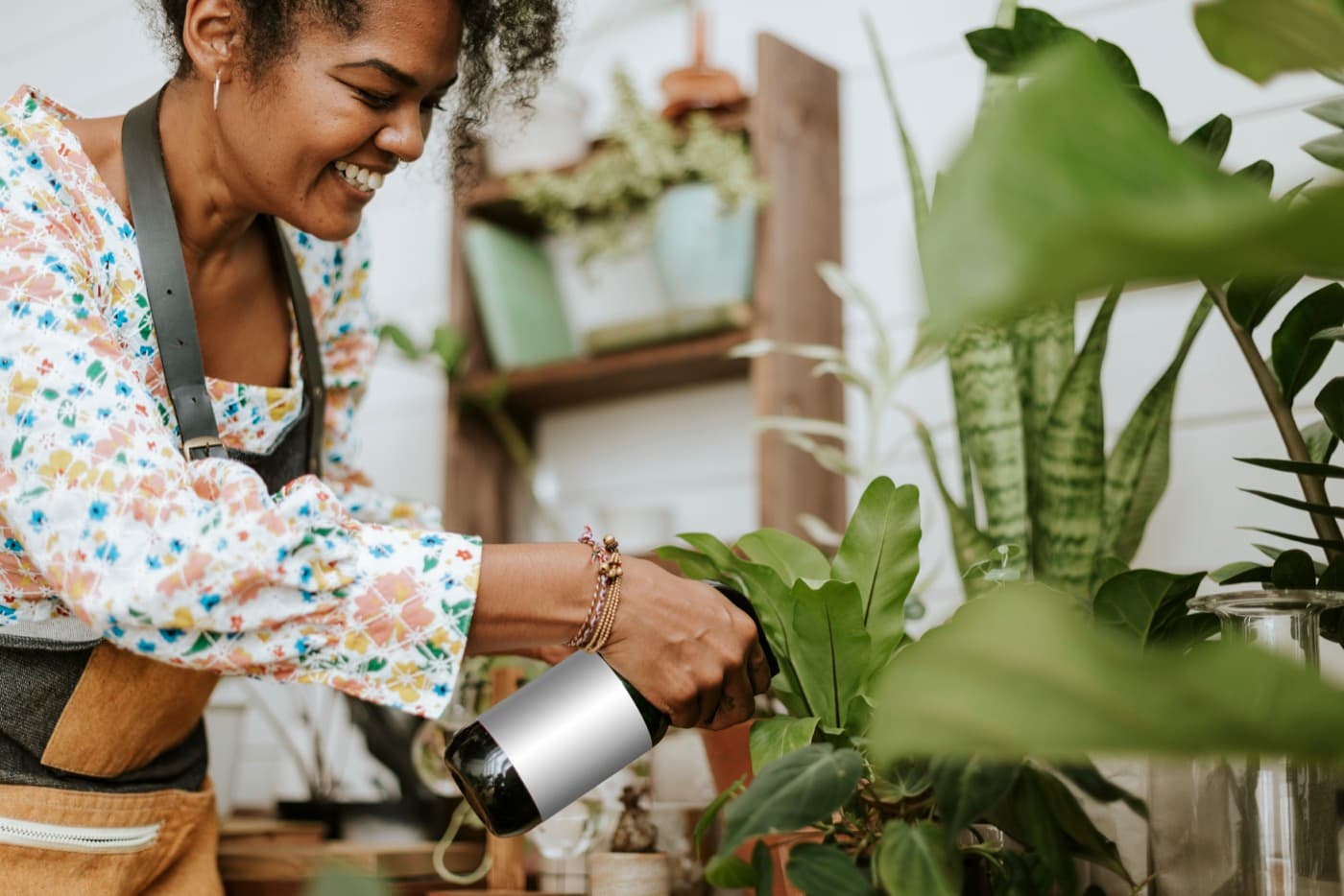 Woman tending to plants in a plant shop